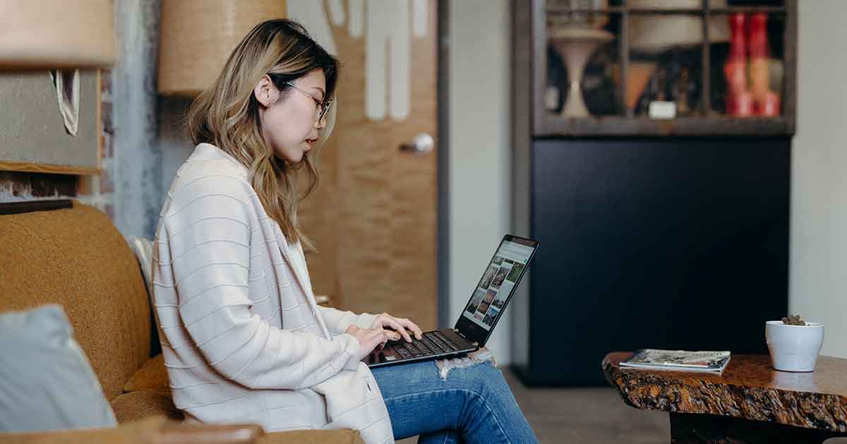 Female on her computer studying for her interpreter certification test