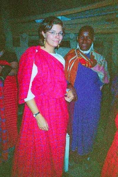 Brie standing next to a Maasai tribal member.