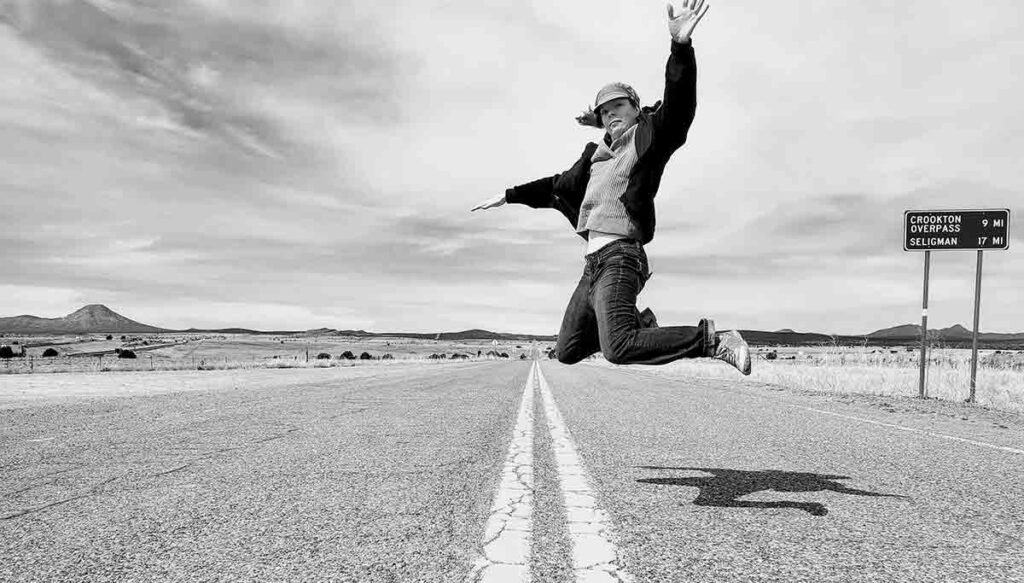 Brie jumps in the middle of a road while on vacation to White Sands National Park in New Mexico.