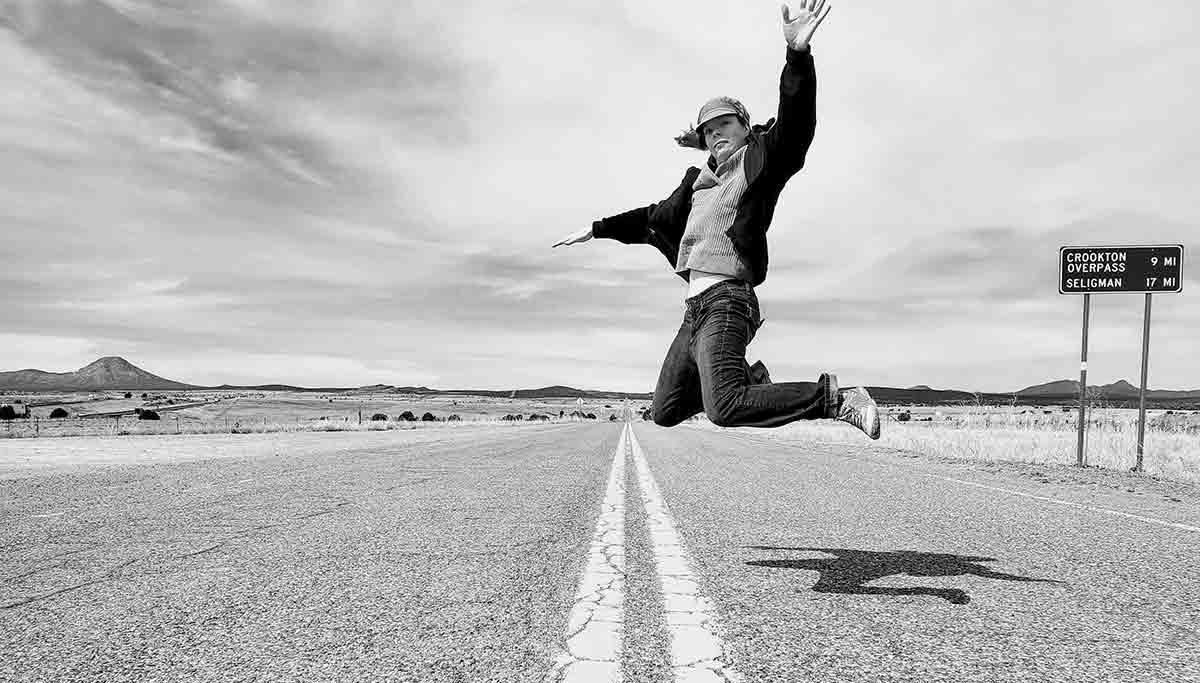 Brie jumps in the middle of a road while on vacation to White Sands National Park in New Mexico.