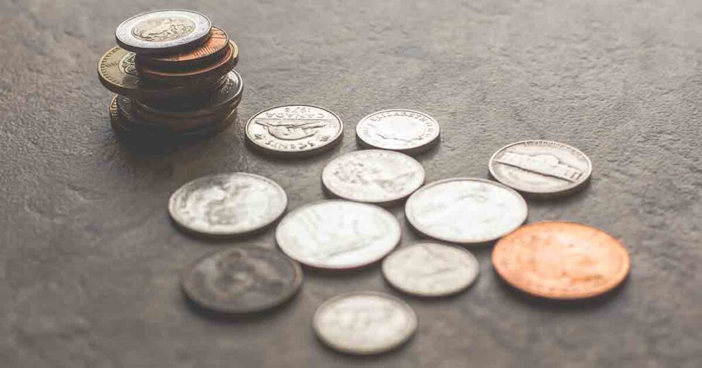 Several coins from different countries on a table