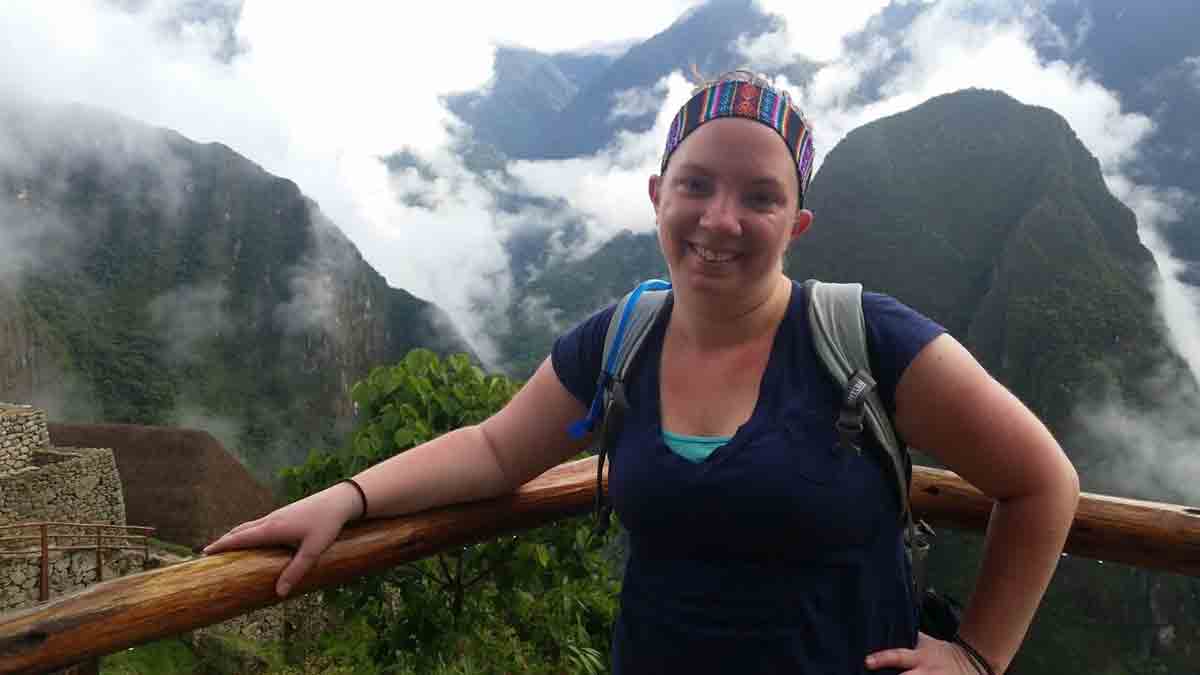 Corissa smiles atop a sightseeing post at Machu Picchu in Peru.