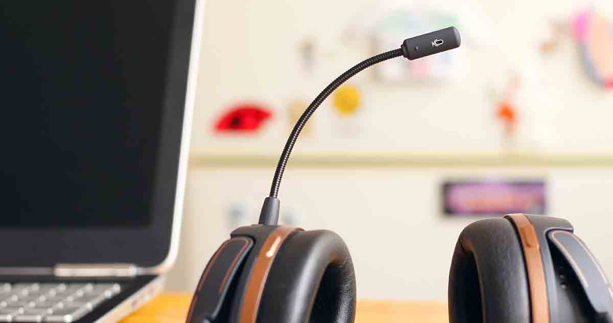 Close-up of headset and computer an interpreter uses for video or phone sessions in healthcare