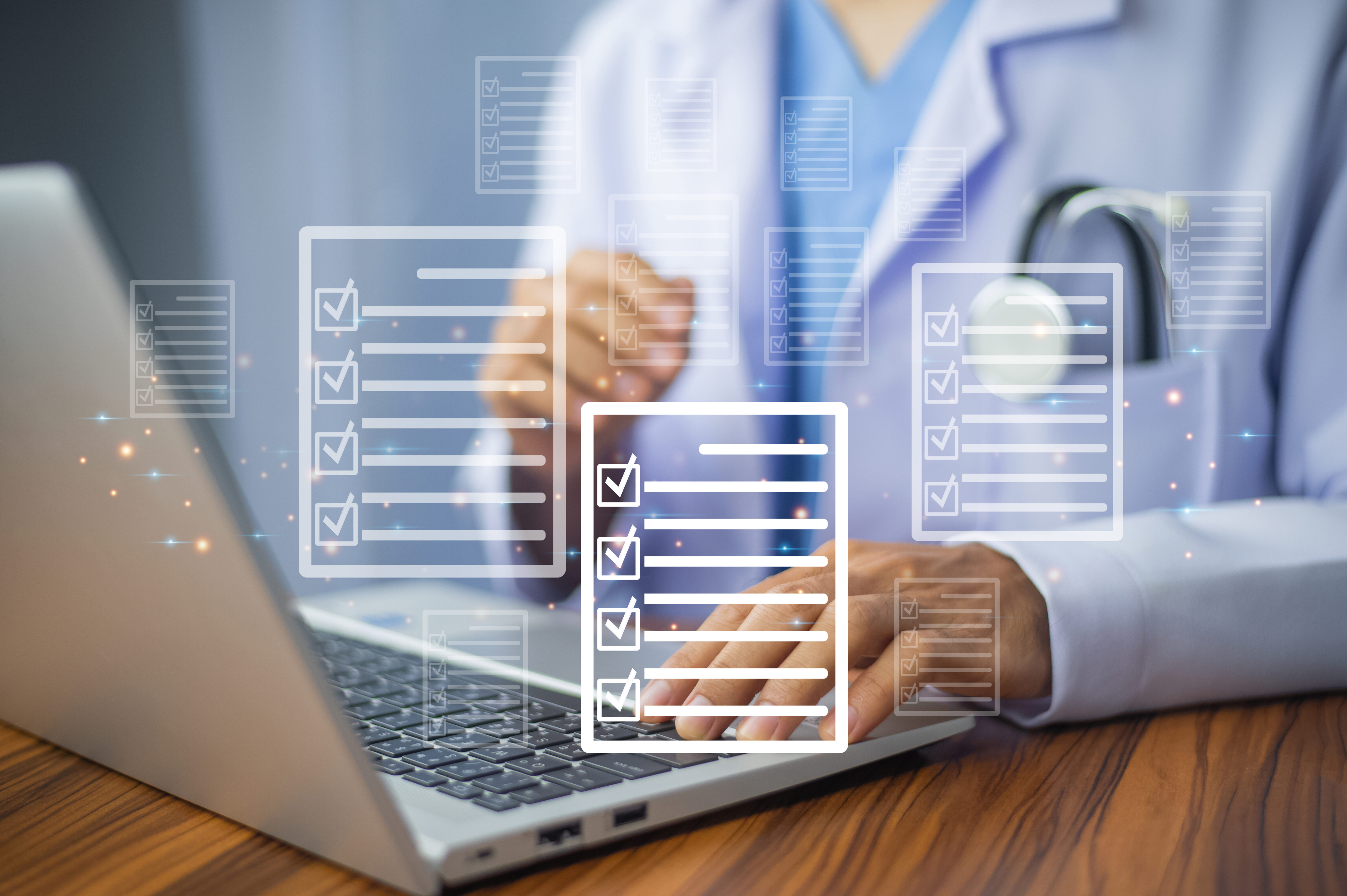 Clinician using a laptop to look through the checklists provided in toolkit A.