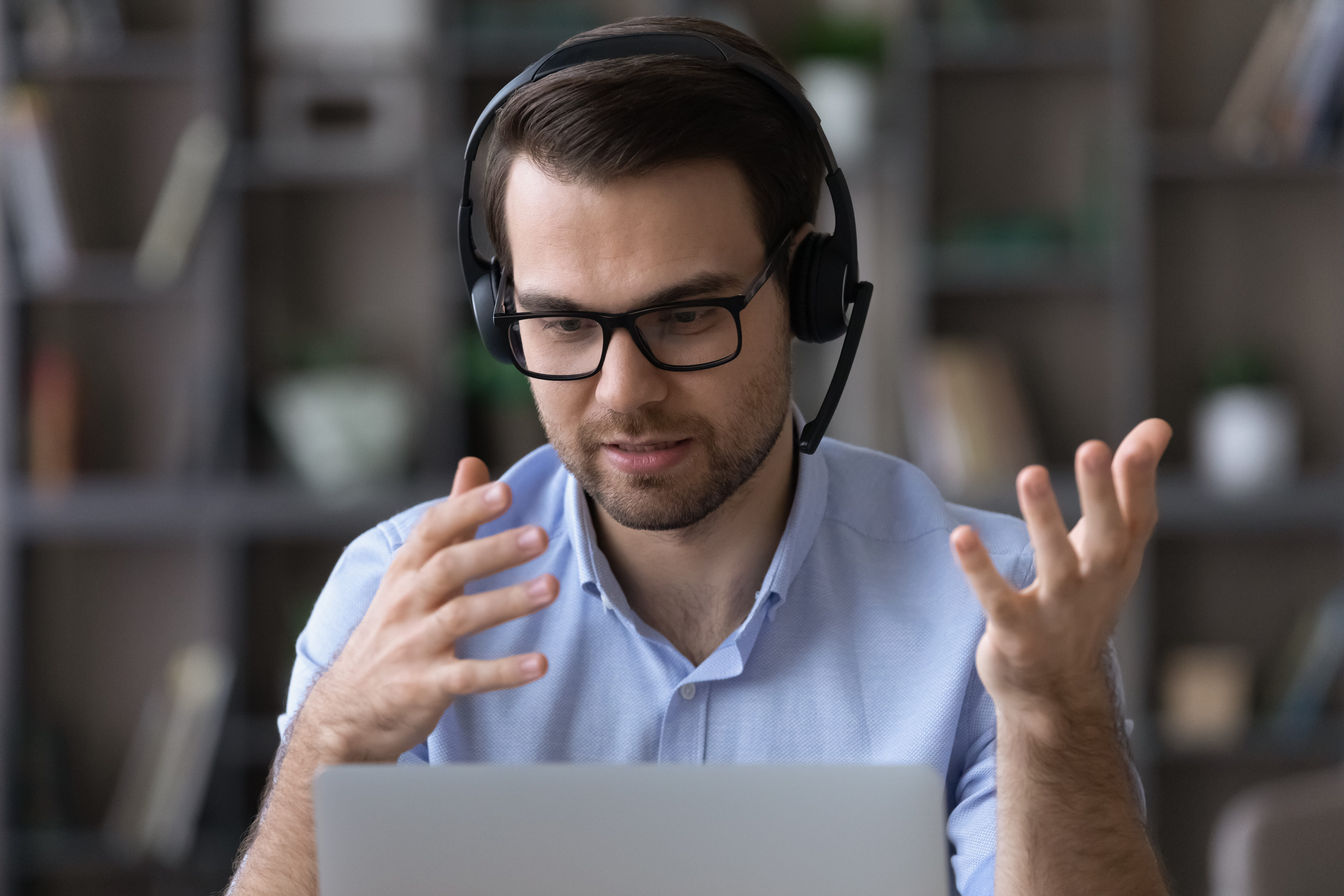 Video remote interpreter speaking to a medical professional and patient